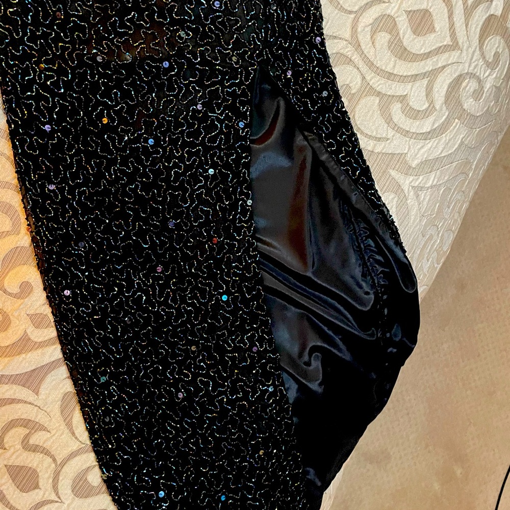 Black all sequin size small. Halter with front slit. Great condition